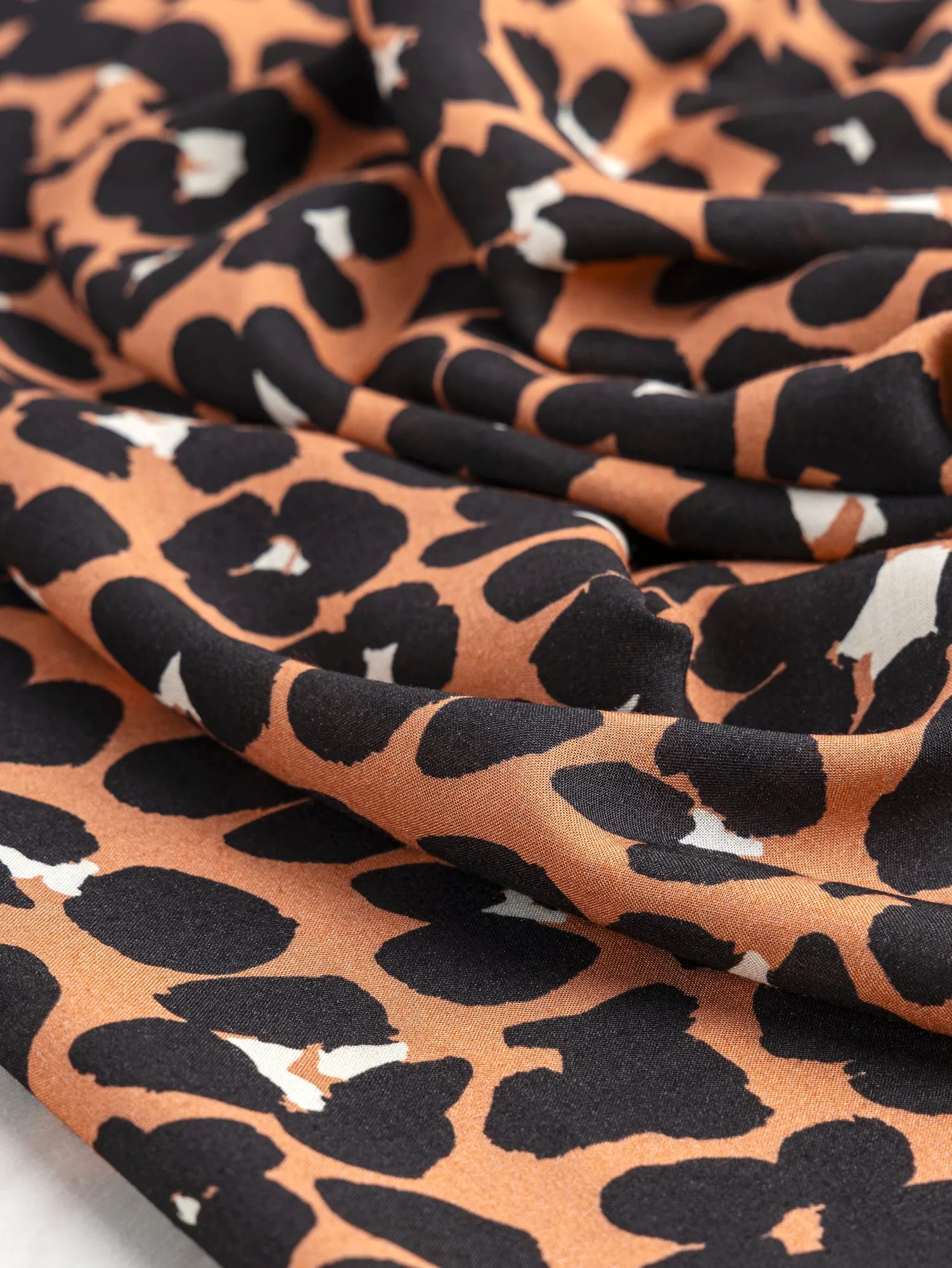 Cheetah Print Ecovero Viscose Challis Deadstock - Sienna   Black   Cream - Swatch